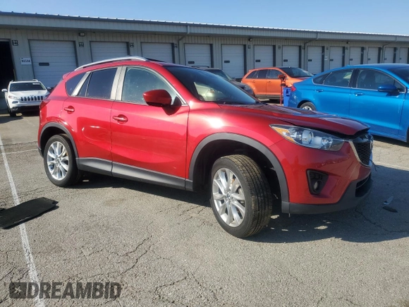 2014 Mazda CX-5 Grand Touring with VIN JM3KE4DY9E0419111, listed as a Copart auction lot 52250315 with 130,003 mi miles and Salvage Title. Bid and sale history available at DreamBid. Image 4.