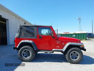 1999 Jeep Wrangler Sport with VIN 1J4FY19S0XP468304, listed as a IAAI auction lot 40038580 with 123,247 mi miles. Bid and sale history available at carsss.com. Image 13.
