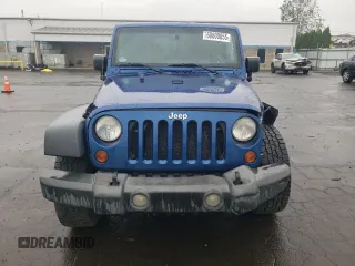 2009 Jeep Wrangler X with VIN 1J4FA24109L712701, listed as a Copart auction lot 60800855 with 156,709 mi miles and Salvage title. Bid and sale history available at DreamBid. Image 5.