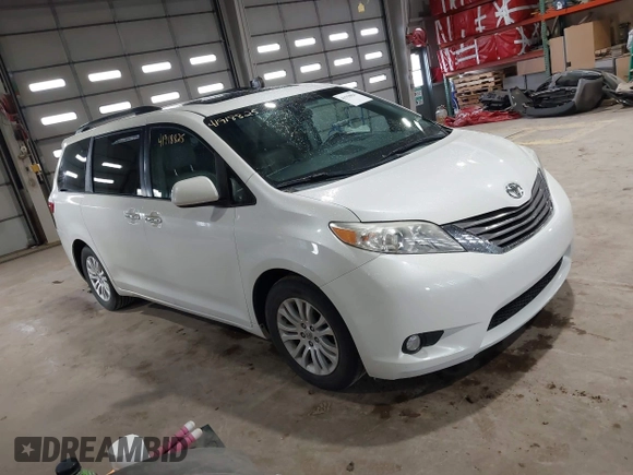 2015 Toyota Sienna XLE with VIN 5TDYK3DC8FS598525, listed as a IAAI auction lot 41918825 with 128,557 mi miles. Bid and sale history available at carsss.com. Image 1.