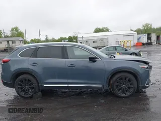 2021 Mazda CX-9 Grand Touring z VIN JM3TCBDY8M0528365, wystawiony jako IAAI lot #42222394 z przebiegiem 44 850 mil mil oraz . Historia ofert i sprzedaży dostępna na DreamBid. Obrazek 13.