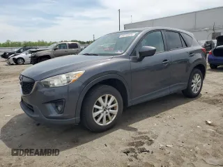 2014 Mazda CX-5 Touring z VIN JM3KE4CY1E0390480, wystawiony jako Copart lot #54216425 z przebiegiem 138 546 mil mil oraz Szkody całkowita. Historia ofert i sprzedaży dostępna na DreamBid. Obrazek 1.