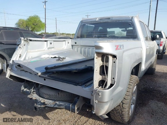 2017 Chevrolet Silverado 1500 LT with VIN 3GCUKREC2HG392487, listed as a IAAI auction lot 41807394 with 113,041 mi miles. Bid and sale history available at carsss.com. Image 4.