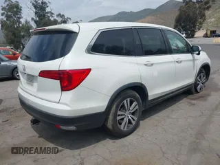 2016 Honda Pilot EX-L with VIN 5FNYF5H55GB015166, listed as a IAAI auction lot 42003009 with 142,488 mi miles and . Bid and sale history available at DreamBid. Image 4.