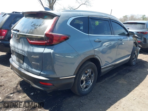 2020 Honda CR-V Touring with VIN 2HKRW2H95LH609144, listed as a IAAI auction lot 41982411 with 36,374 mi miles and . Bid and sale history available at DreamBid. Image 4.