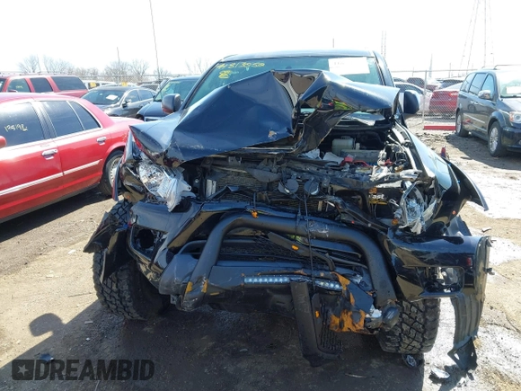 2015 Toyota Tacoma z VIN 5TFLU4EN6FX123489, wystawiony jako IAAI lot #41813057 z przebiegiem 104 828 mil mil oraz . Historia ofert i sprzedaży dostępna na DreamBid. Obrazek 12.
