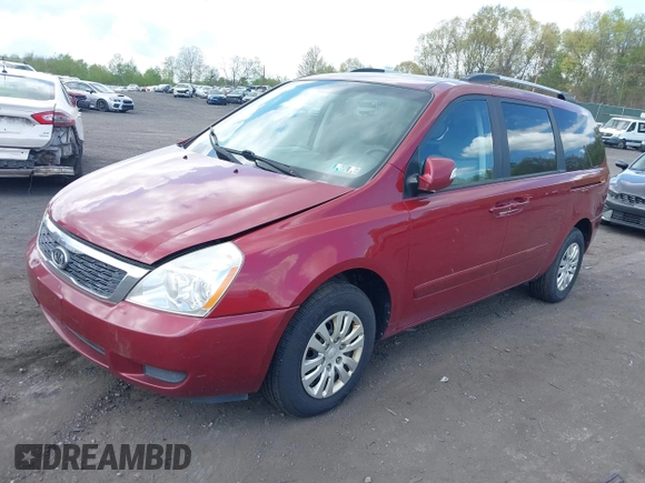 2012 Kia Sedona LX with VIN KNDMG4C76C6453523, listed as a IAAI auction lot 42189376 with 207,557 mi miles. Bid and sale history available at carsss.com. Image 2.
