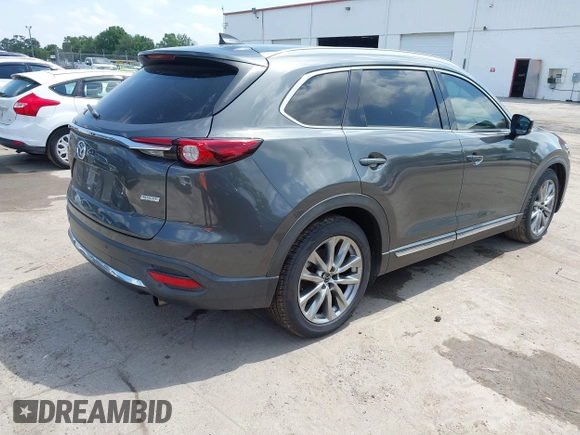 2016 Mazda CX-9 Signature with VIN JM3TCBEY9G0100579, listed as a IAAI auction lot 42282293 with 142,700 mi miles and . Bid and sale history available at DreamBid. Image 4.