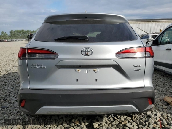 2023 Toyota Corolla Cross XLE with VIN 7MUDAABG6PV078570, listed as a Copart auction lot 65246535 with 21,928 mi miles and Salvage title. Bid and sale history available at DreamBid. Image 6.