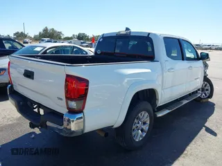 2018 Toyota Tacoma SR5 with VIN 5TFAZ5CN4JX056465, listed as a IAAI auction lot 41767848 with 71,532 mi miles and . Bid and sale history available at DreamBid. Image 4.