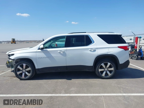 2018 Chevrolet Traverse LT z VIN 1GNEVHKW3JJ125861, wystawiony jako IAAI lot #41876184 z przebiegiem 95 223 mil mil oraz . Historia ofert i sprzedaży dostępna na DreamBid. Obrazek 14.