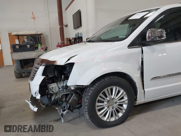 2014 Chrysler Town & Country Limited with VIN 2C4RC1GG7ER178802, listed as a IAAI auction lot 41863918 with 103,777 mi miles and . Bid and sale history available at DreamBid. Image 6.