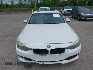 2015 BMW 3 Series 328i with VIN WBA3A5C50FF608327, listed as a IAAI auction lot 42136156 with 213,945 mi miles. Bid and sale history available at carsss.com. Image 12.