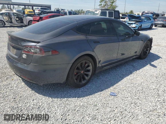 2016 Tesla Model S 90D with VIN 5YJSA1E27GF171698, listed as a Copart auction lot 49176205 with 107,913 mi miles and Salvage Title. Bid and sale history available at DreamBid. Image 3.