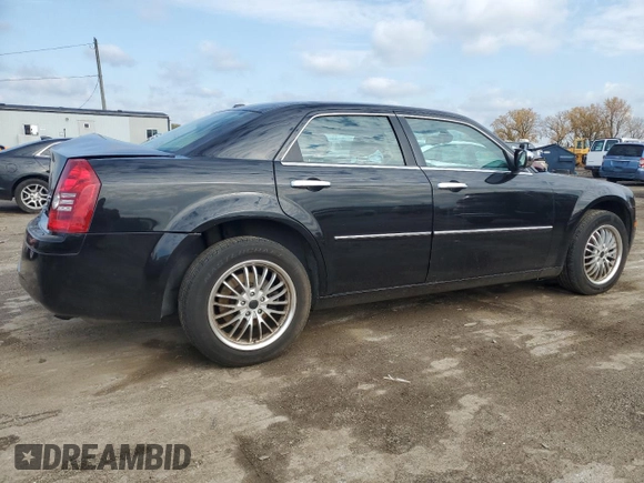 2009 Chrysler 300 with VIN 2C3LK33V19H614083, listed as a Copart auction lot 77529014 with 188,125 mi miles and Salvage title. Bid and sale history available at DreamBid. Image 3.