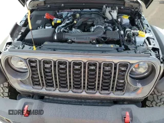 2024 Jeep Wrangler Rubicon z VIN 1C4PJXFG6RW261748, wystawiony jako Copart lot #44166485 z przebiegiem 7 911 mil mil oraz Szkoda całkowita • Salvage title. Historia ofert i sprzedaży dostępna na DreamBid. Obrazek 11.