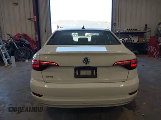 2021 Volkswagen Jetta S z VIN 3VWC57BU5MM046236, wystawiony jako IAAI lot #41740297 z przebiegiem 57 769 mil mil oraz . Historia ofert i sprzedaży dostępna na DreamBid. Obrazek 17.
