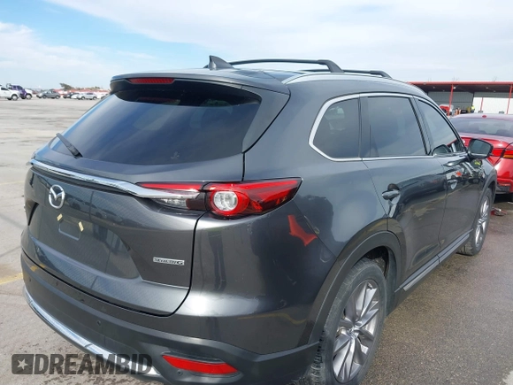 2023 Mazda CX-9 Grand Touring z VIN JM3TCBDY0P0631395, wystawiony jako IAAI lot #41449555 z przebiegiem 17 721 mil mil oraz . Historia ofert i sprzedaży dostępna na DreamBid. Obrazek 4.