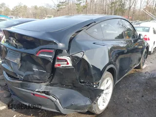 2023 Tesla Model Y Long Range z VIN 7SAYGAEE5PF603128, wystawiony jako IAAI lot #41328797 z przebiegiem 63 527 mil mil oraz . Historia ofert i sprzedaży dostępna na DreamBid. Obrazek 19.