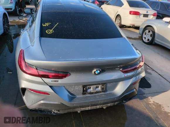 2023 BMW 8 Series M850i z VIN WBAGV8C02PCL20503, wystawiony jako Copart lot #74098614 z przebiegiem Nie podano mil oraz Szkoda całkowita • Salvage title. Historia ofert i sprzedaży dostępna na DreamBid. Obrazek 6.