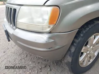 1999 Jeep Grand Cherokee Limited with VIN 1J4GW68N5XC684157, listed as a IAAI auction lot 42104283 with 164,506 mi miles. Bid and sale history available at carsss.com. Image 6.