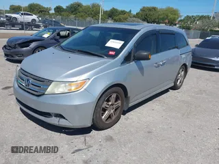 2012 Honda Odyssey Touring with VIN 5FNRL5H90CB099519, listed as a IAAI auction lot 41854550 with 185,110 mi miles. Bid and sale history available at carsss.com. Image 2.