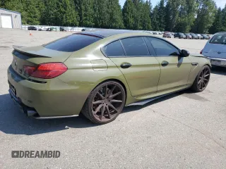 2017 BMW M6 z VIN WBS6E9C53HG437414, wystawiony jako Copart lot #61141685 z przebiegiem 89 893 mil mil oraz Szkoda całkowita • Salvage title. Historia ofert i sprzedaży dostępna na DreamBid. Obrazek 3.