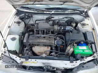 1994 Toyota Corolla Deluxe with VIN JT2AE09B5R0053731, listed as a IAAI auction lot 42606147 with 117,035 mi miles and . Bid and sale history available at DreamBid. Image 10.