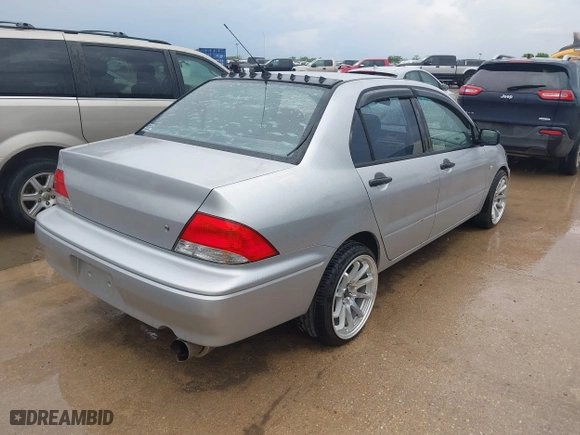 2003 Mitsubishi Lancer ES with VIN JA3AJ26E43U038813, listed as a IAAI auction lot 41778956 with 150,764 mi miles. Bid and sale history available at carsss.com. Image 4.