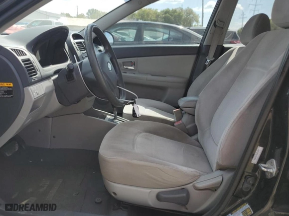 2009 Kia Spectra EX with VIN KNAFE221295624733, listed as a Copart auction lot 72229664 with 115,179 mi miles and Salvage Title. Bid and sale history available at carsss.com. Image 7.