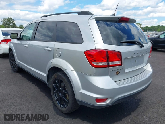 2014 Dodge Journey SXT with VIN 3C4PDCBB0ET281861, listed as a IAAI auction lot 42187485 with 124,191 mi miles and . Bid and sale history available at DreamBid. Image 3.