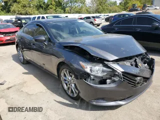 2014 Mazda 6 i Grand Touring с VIN JM1GJ1W67E1135264, выставлен на аукционе Copart как лот 70587624 с пробегом 86 926 миль миль и Списание • Salvage title. История ставок и продаж доступна на DreamBid. Изображение 4.