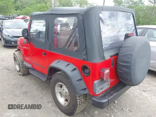 1999 Jeep Wrangler SE z VIN 1J4FY29P5XP487111, wystawiony jako IAAI lot #42125867 z przebiegiem 156 804 mil mil oraz . Historia ofert i sprzedaży dostępna na DreamBid. Obrazek 3.