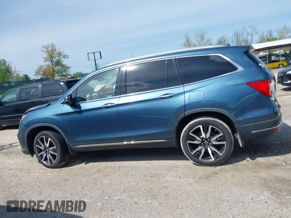 2020 Honda Pilot Touring 8-Passenger with VIN 5FNYF6H93LB034009, listed as a IAAI auction lot 42090993 with 73,325 mi miles and . Bid and sale history available at carsss.com. Image 14.