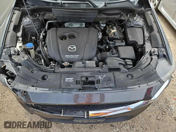 2018 Mazda CX-5 Touring z VIN JM3KFBCM4J0349687, wystawiony jako Copart lot #55857945 z przebiegiem Nie podano mil oraz Szkoda całkowita • Salvage title. Historia ofert i sprzedaży dostępna na DreamBid. Obrazek 12.