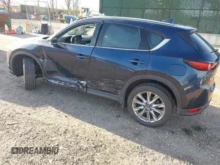 2020 Mazda CX-5 Grand Touring with VIN JM3KFBDM4L0779284, listed as a IAAI auction lot 42060936 with 9,227 mi miles. Bid and sale history available at carsss.com. Image 3.