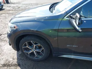 2016 BMW X1 xDrive28i with VIN WBXHT3C35GP886094, listed as a IAAI auction lot 42009639 with 61,739 mi miles. Bid and sale history available at carsss.com. Image 18.