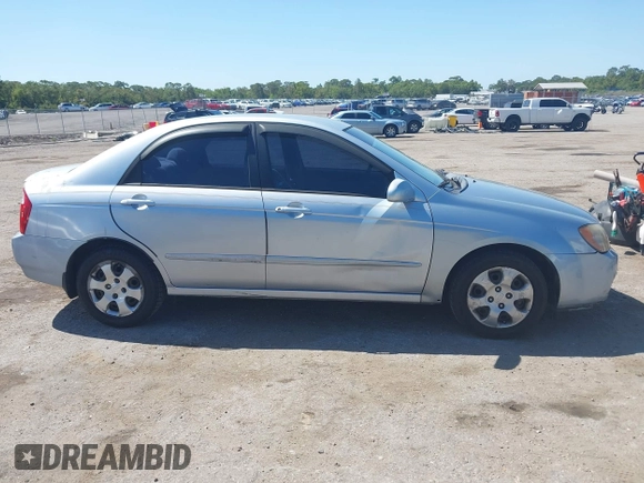 2005 Kia Spectra LX with VIN KNAFE121955107403, listed as a IAAI auction lot 42055036 with 157,605 mi miles. Bid and sale history available at carsss.com. Image 13.