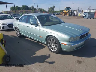 2004 Jaguar XJ 8 with VIN SAJEA71CX4SG10751, listed as a IAAI auction lot 42149348 with 89,786 mi miles and . Bid and sale history available at DreamBid. Image 1.