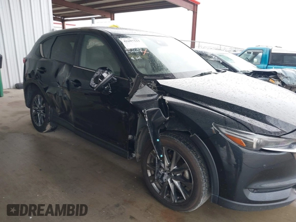 2021 Mazda CX-5 Signature with VIN JM3KFBEY5M0432033, listed as a IAAI auction lot 41607215 with 49,870 mi miles. Bid and sale history available at carsss.com. Image 6.