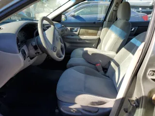 2001 Ford Taurus LX Standard z VIN 1FAFP52U51A138332, wystawiony jako Copart lot #88528355 z przebiegiem 166 511 mil mil oraz Szkoda całkowita • Salvage title. Historia ofert i sprzedaży dostępna na DreamBid. Obrazek 7.