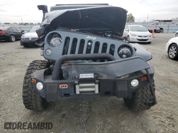2015 Jeep Wrangler Unlimited Rubicon with VIN 1C4BJWFG7FL674201, listed as a Copart auction lot 49466455 with 0 mi miles and Salvage Title. Bid and sale history available at carsss.com. Image 5.