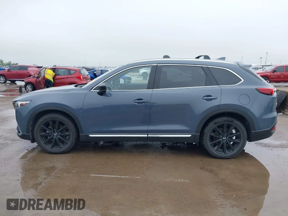 2021 Mazda CX-9 Grand Touring with VIN JM3TCBDY9M0534966, listed as a IAAI auction lot 42166071 with 77,817 mi miles and . Bid and sale history available at DreamBid. Image 14.