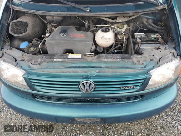 1999 Volkswagen EuroVan с VIN WV2MH8708XH001005, выставлен на аукционе Copart как лот 48987245 с пробегом 210 081 миль миль и Чистый • Clean title. История ставок и продаж доступна на DreamBid. Изображение 12.