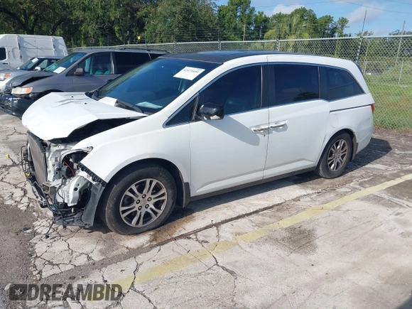 2012 Honda Odyssey EX-L z VIN 5FNRL5H61CB032353, wystawiony jako IAAI lot #42471691 z przebiegiem 186 257 mil mil oraz . Historia ofert i sprzedaży dostępna na DreamBid. Obrazek 17.