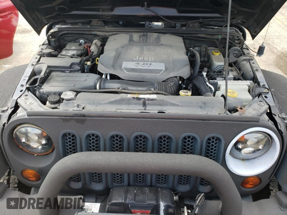 2013 Jeep Wrangler Unlimited Rubicon 10th Anniversary with VIN 1C4HJWFGXDL543660, listed as a Copart auction lot 61462104 with 115,897 mi miles and Salvage title. Bid and sale history available at DreamBid. Image 12.