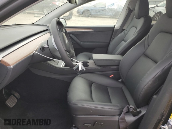 2025 Tesla Model Y Long Range with VIN 7SAYGDED6SF227475, listed as a Copart auction lot 42634345 with 3,493 mi miles and Salvage Title. Bid and sale history available at DreamBid. Image 7.