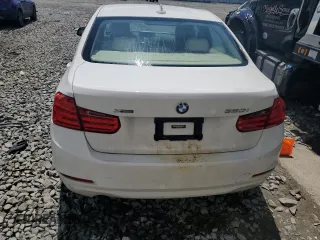 2014 BMW 3 Series 320i xDrive with VIN WBA3C3C51EF983592, listed as a Copart auction lot 60608765 with 195,061 mi miles and Salvage title. Bid and sale history available at DreamBid. Image 6.