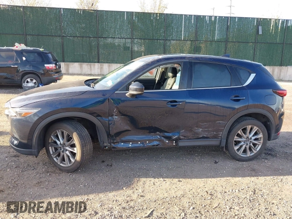 2020 Mazda CX-5 Grand Touring with VIN JM3KFBDM4L0779284, listed as a IAAI auction lot 42060936 with 9,227 mi miles. Bid and sale history available at carsss.com. Image 14.