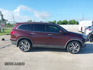 2017 Honda Pilot Touring with VIN 5FNYF5H96HB038413, listed as a IAAI auction lot 42594065 with 130,501 mi miles and . Bid and sale history available at DreamBid. Image 13.